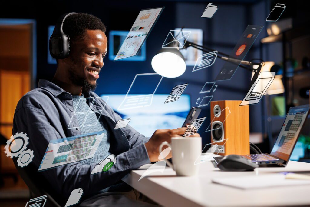 Business person using a laptop while multitasking for ghost commerce and daily startup tasks