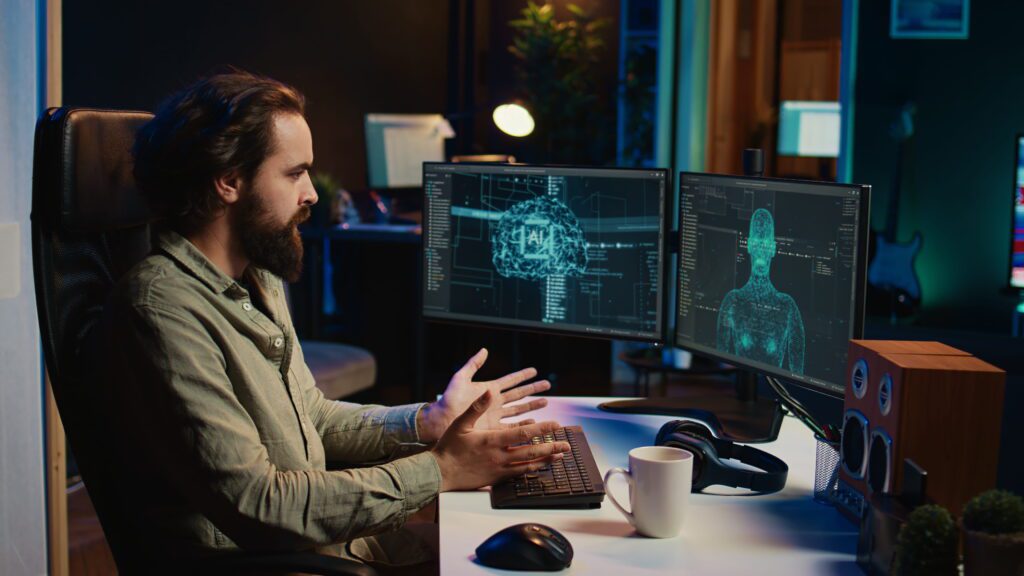 A developer interacting with an AI brain and humanoid model on dual monitors, representing how Claude Code by Anthropic powers intelligent coding assistance for developers