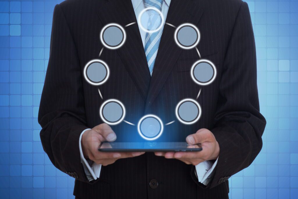 Man using a holographic tablet representing digital technology and ghost commerce business concept