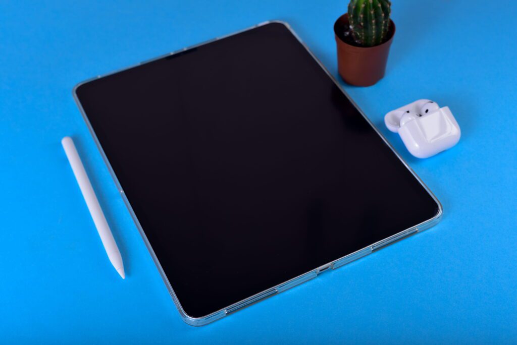 best android tablet for gaming setup flat lay with tablet glasses and desk accessories