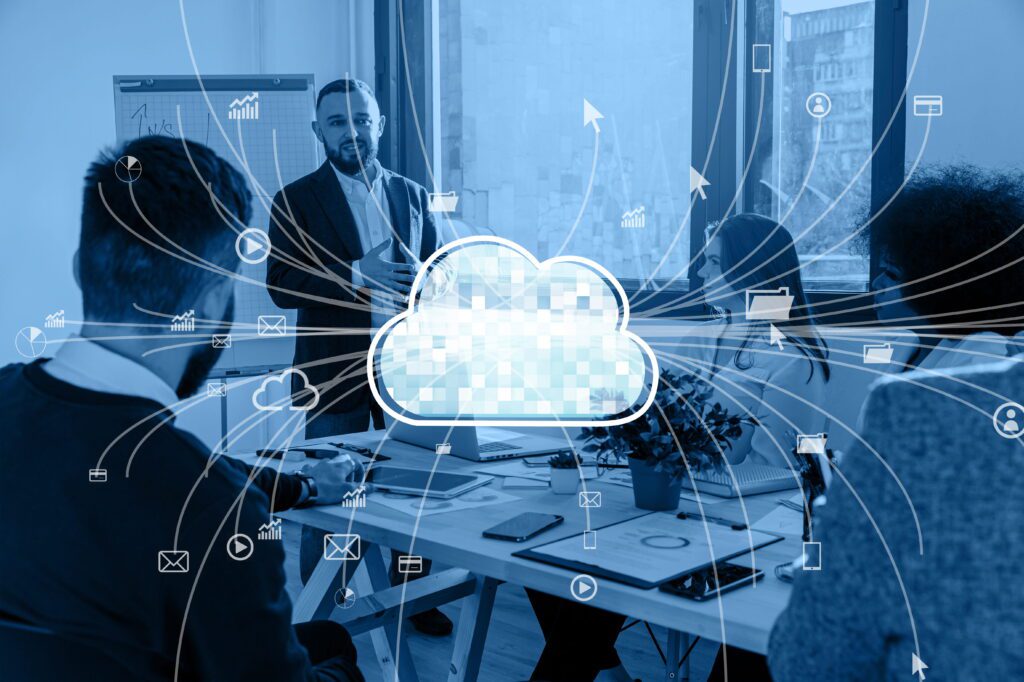 Business team in a meeting discussing cloud security best practices with a digital cloud icon and connected SaaS application icons overlaid representing cloud network security management in 2026